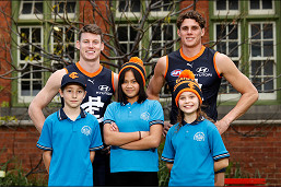 Local AFL team works to stop brutality against women